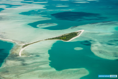 Где находится самый большой атолл?